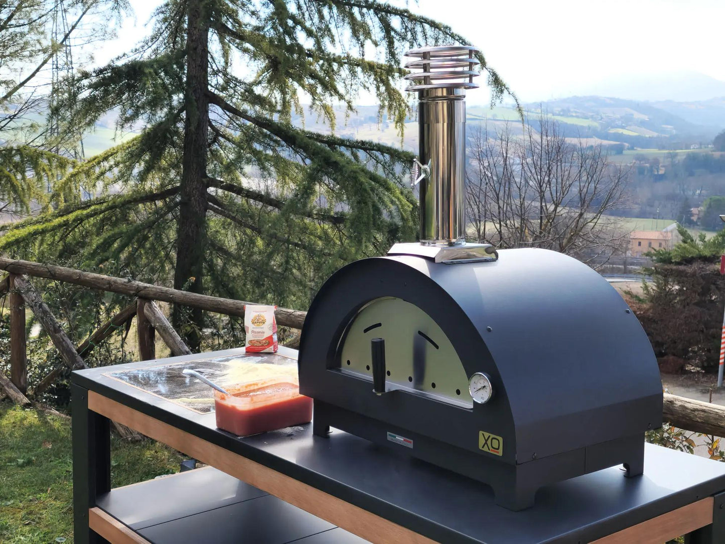 XO APPLIANCE XOPIZZA1SS Tabletop 24" x 16" Wood-Fired Oven in Stainless Steel On Black  - XOPIZZA1SS